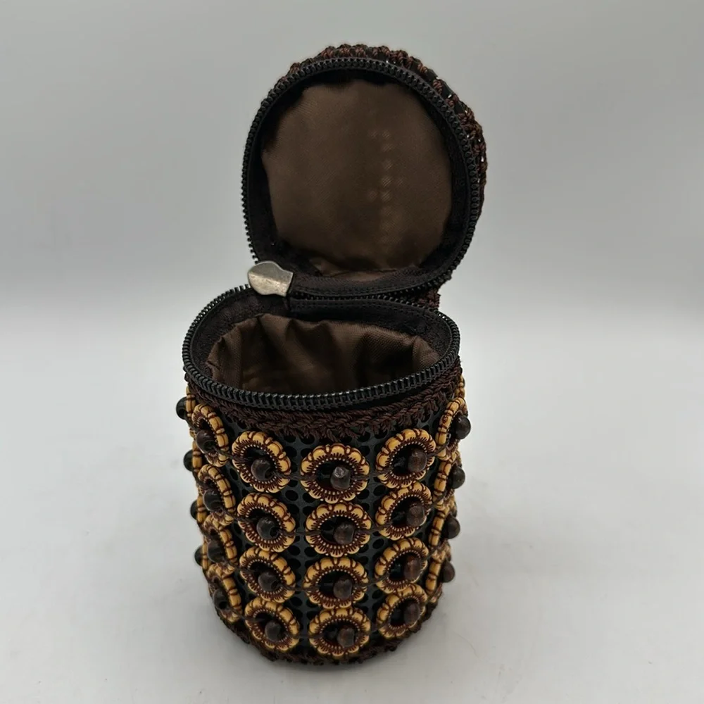 Handheld brown, tan, and black beaded coin purse